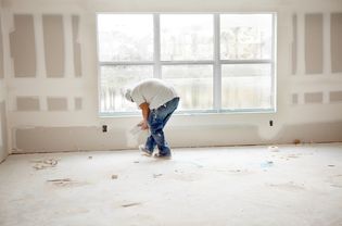 Man applying drywall joint compound