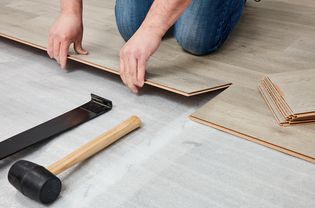 Laminate planks installed over underlayment layer