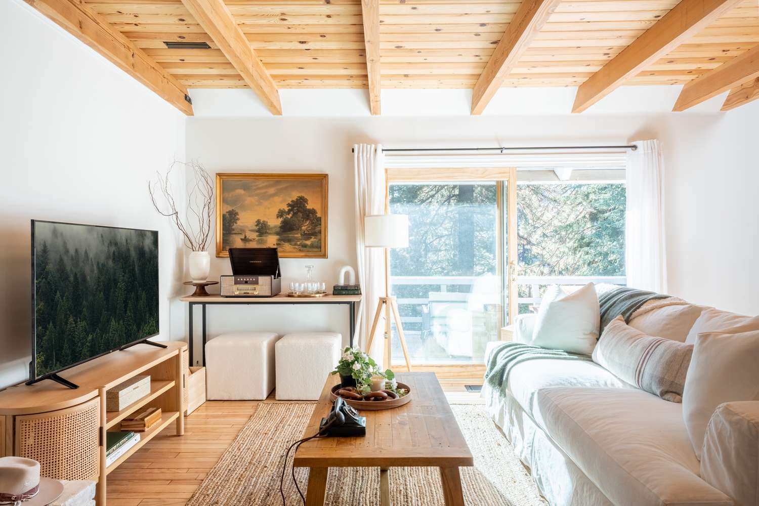 Living room area with a pine slatted wood ceiling