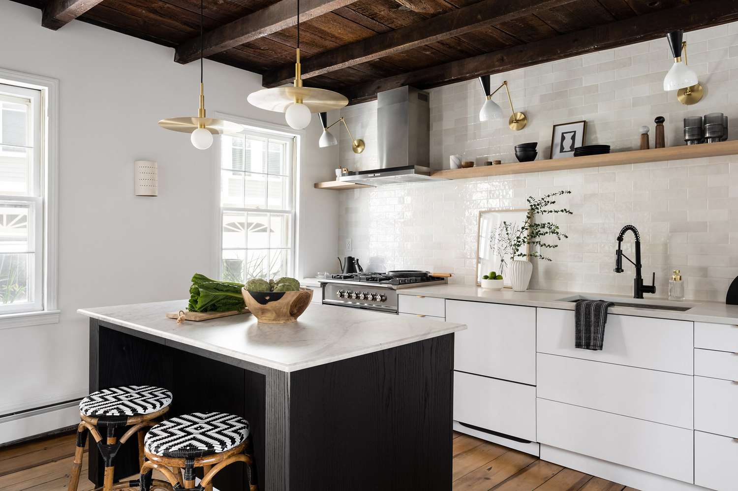 Kitchen with wood on wood ceiling and decorative beams.