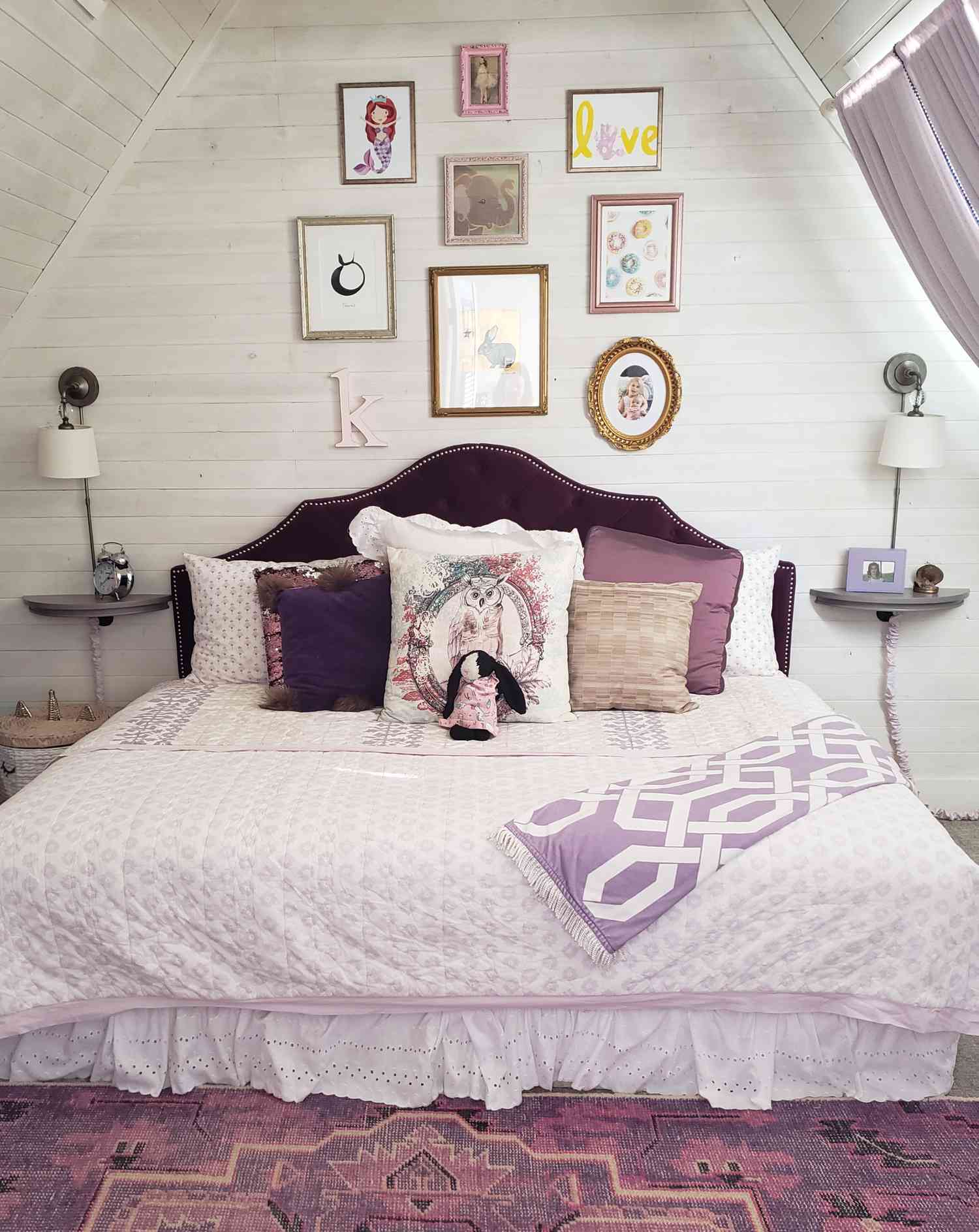 A white shiplap room is covered from floor and across the ceiling in pale white shiplap