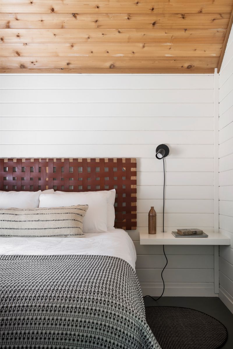 Bedroom with shiplap on the wall and ceiling 