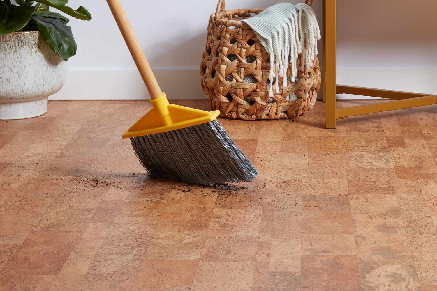 sweeping debris off a cork floor