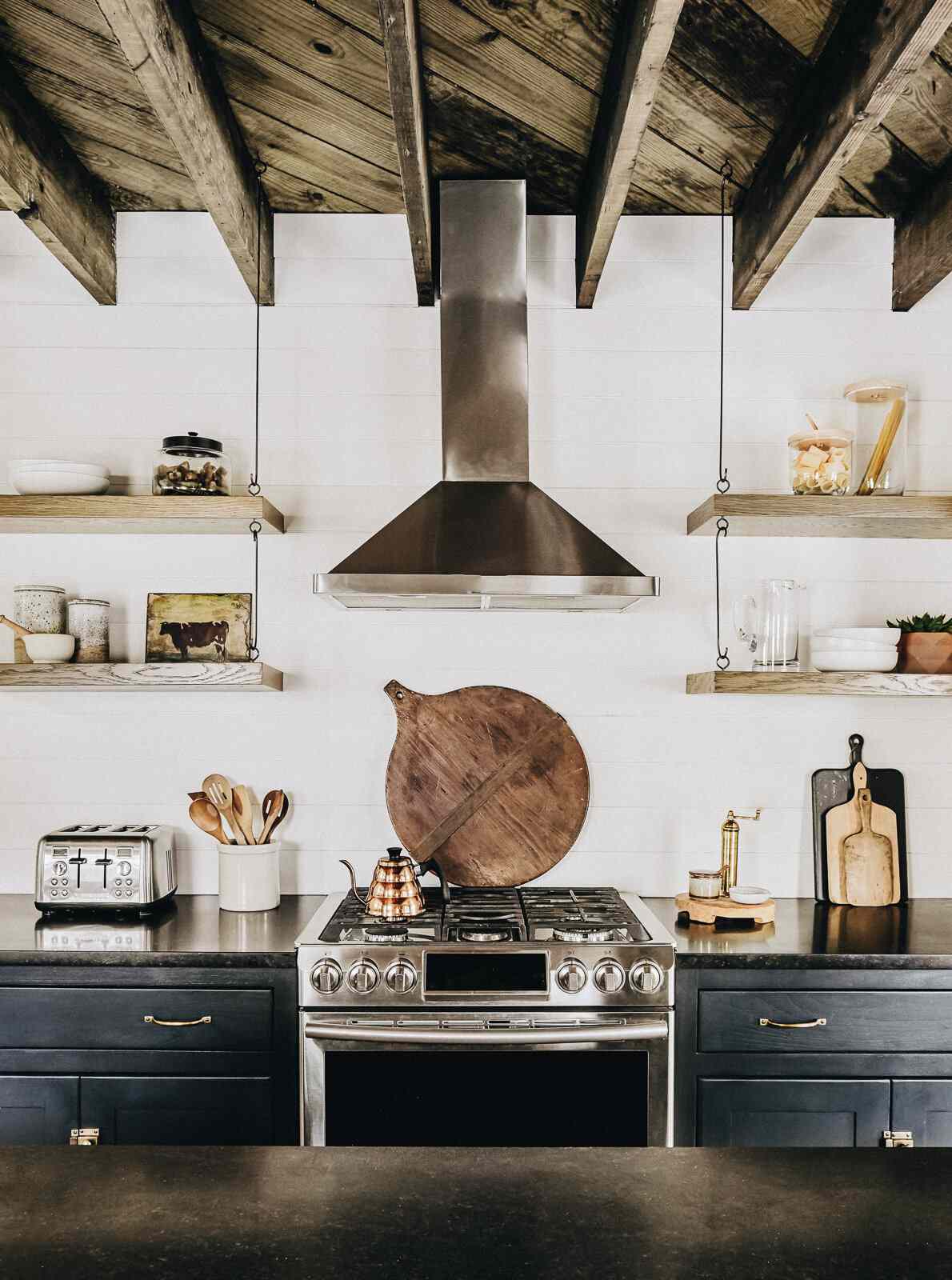 A rustic kitchen with wood-lined ceilings