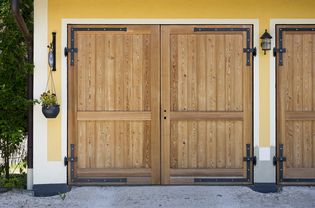 Side-hinged wood garage door.