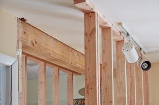 Load bearing wall with wood support beams 