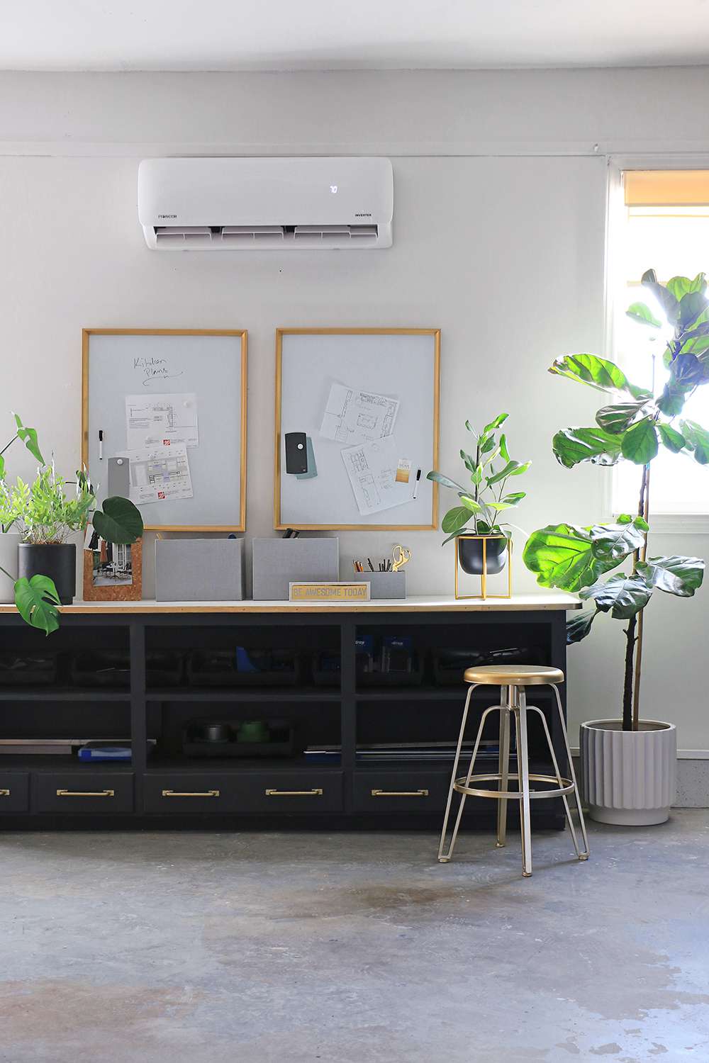 A long desk and whiteboards above it.