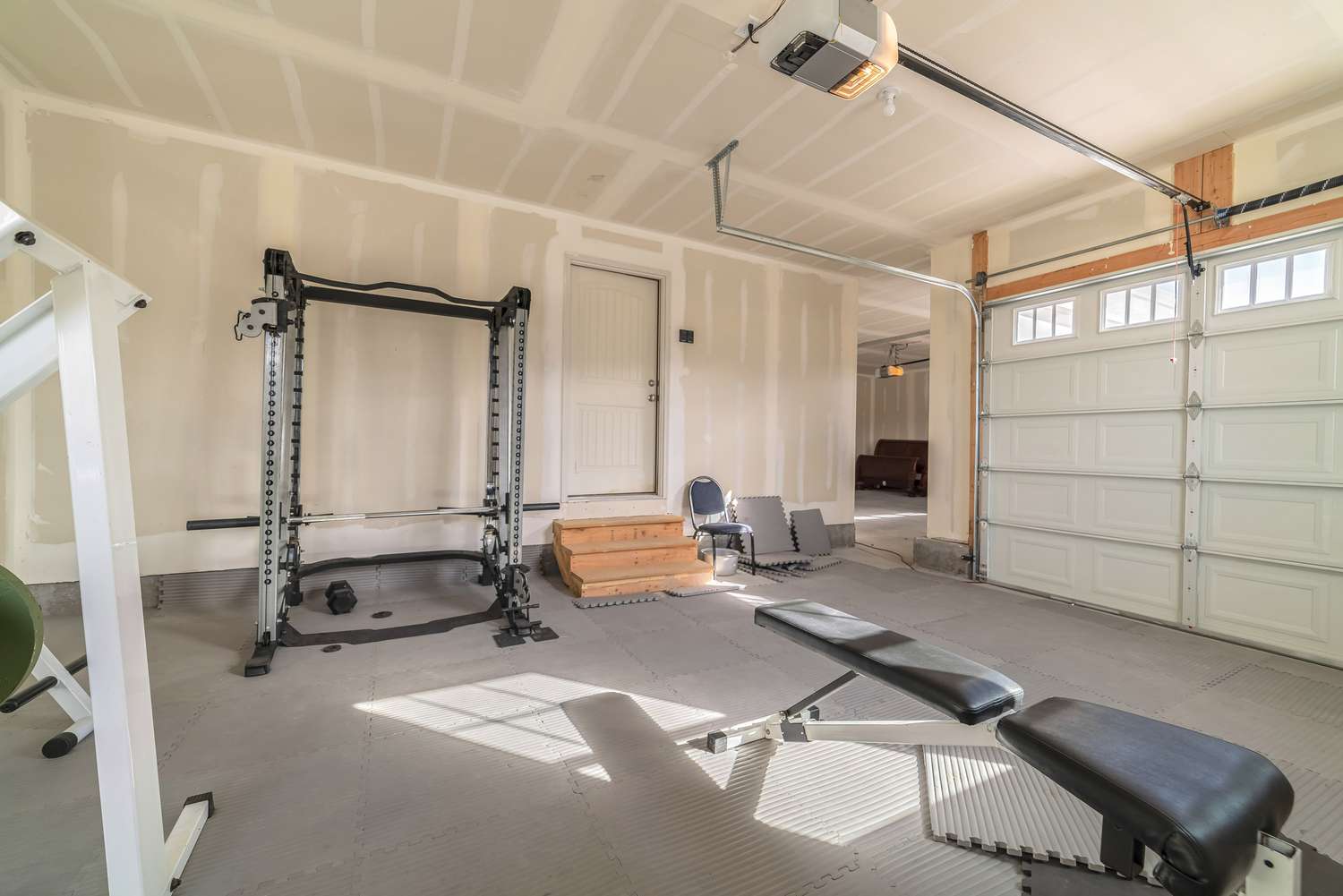 A home gym in a garage.