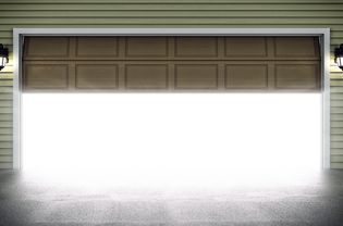 A half-open garage door full of light